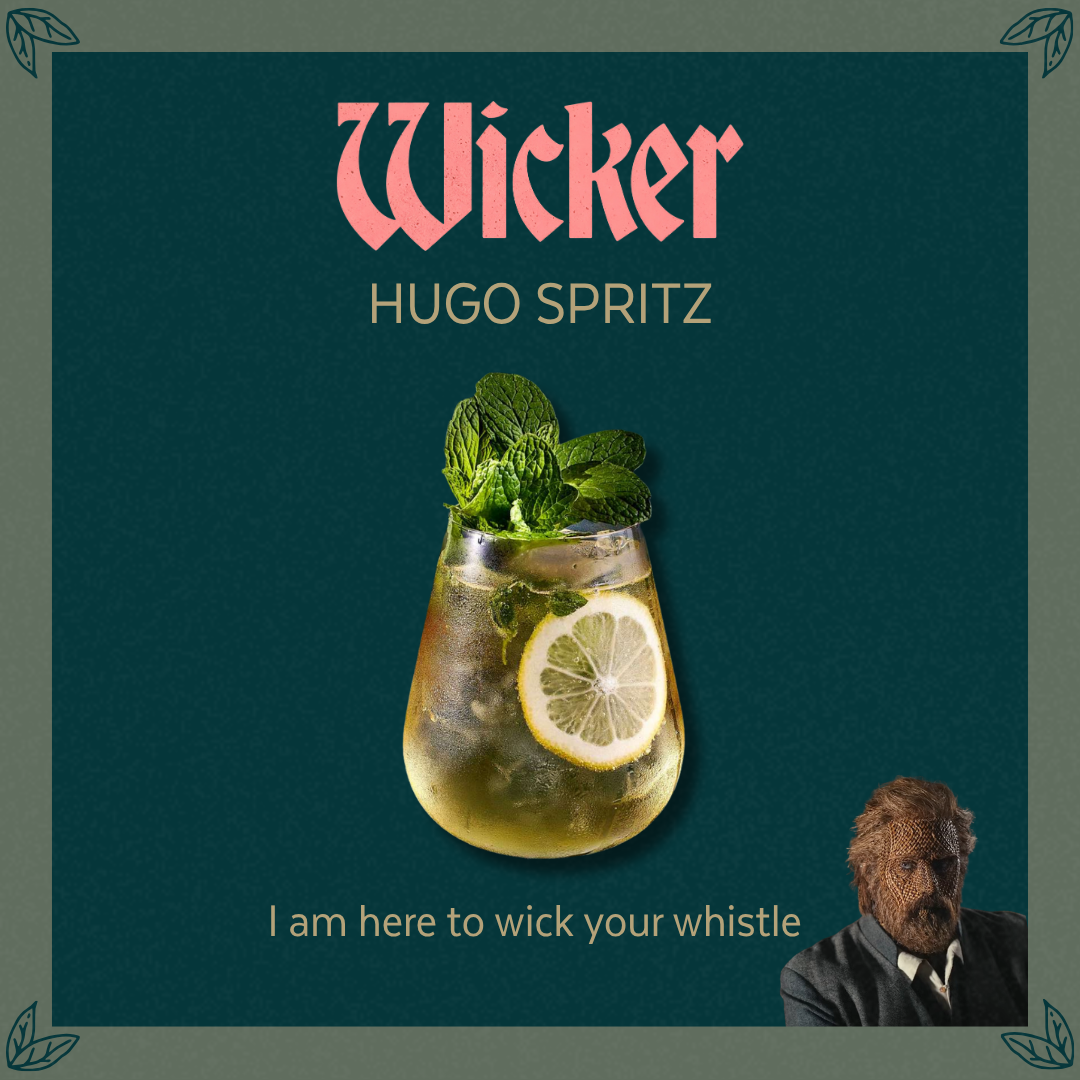 Text: Wicker Hugo Spritz. I am here to wick your whistle. Image: A drink with lime and mint. There is a made made of wicker looking to the side. 